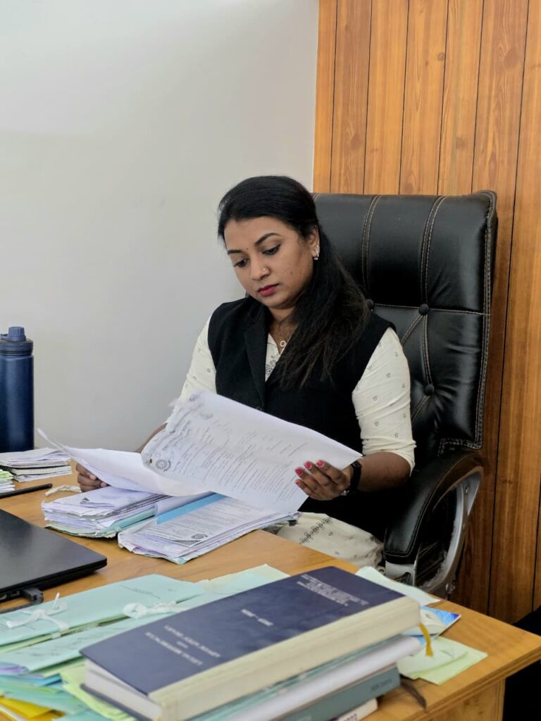 Adv. Vincy J Wilson, advocate practicing at District Court Vanchiyur, Thiruvananthapuram, reviewing legal documents at her office.